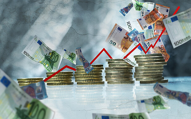 Illustration mit Münzen, Geldscheinen und einem Trendbarometer